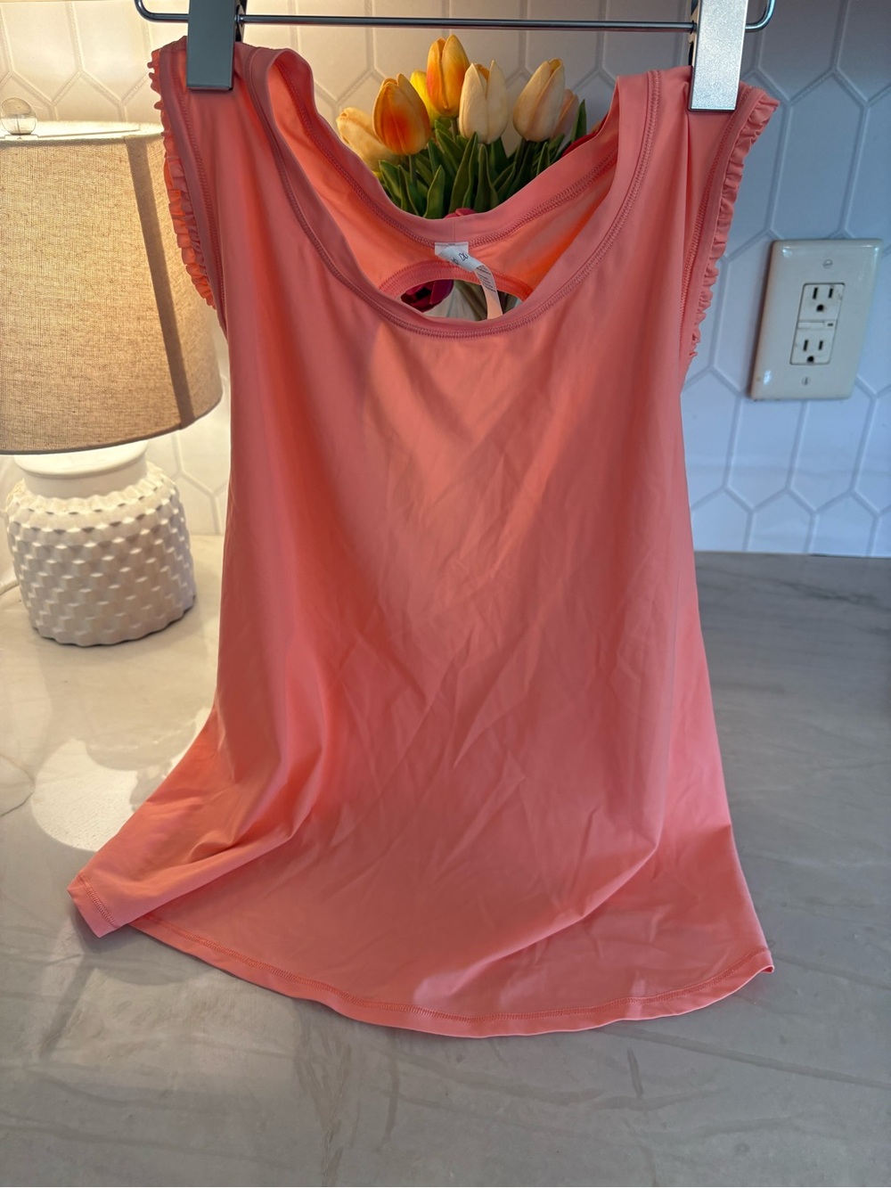 Lululemon Athletica women’s Coral-Orange Ruffle Tank